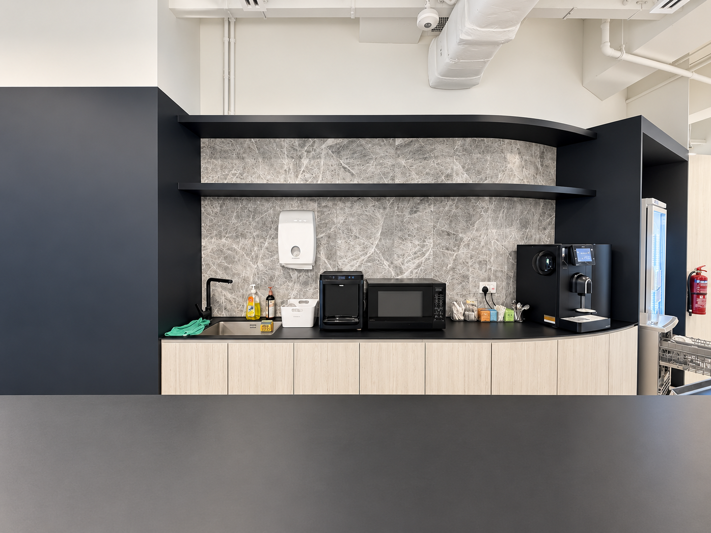 Pantry counter with coffee machine, water dispenser and sink at HarbourFront Tower 2